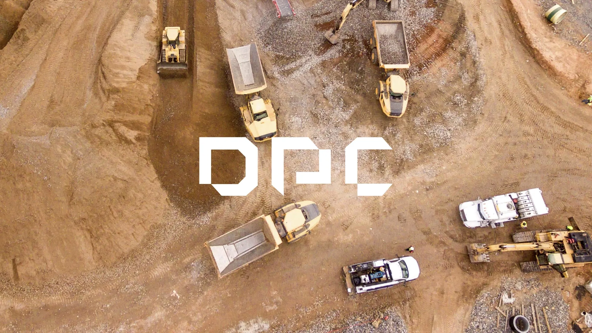 DPC identity over an aerial view of a mining site